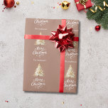 Tree snow mocha brown Christmas Wrapping Paper<br><div class="desc">A mocha,  muted brown background,  white text.  Decorated with a snowcovered pine tree. Merry Christmas is written with an elegant hand-lettered style script.  Personalise and add your family name.</div>