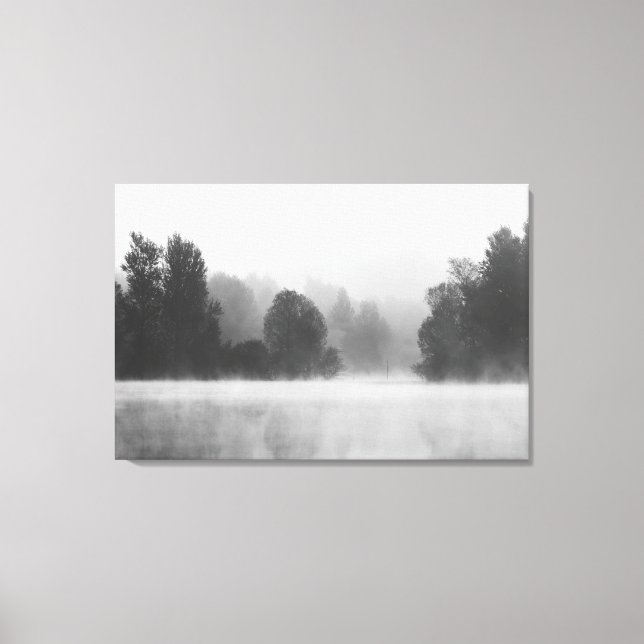 Trees disappearing in morning fog above the lake canvas print (Front)