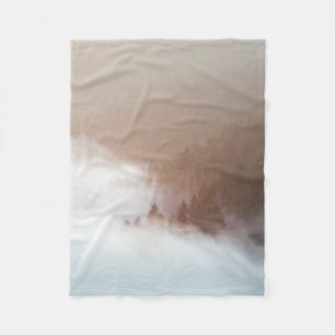 Trees on mountain covered with fogs fleece blanket