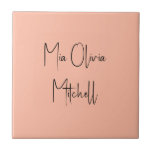 Trend Colour Soft Peach Name Ceramic Tile<br><div class="desc">Introducing the trendy spring shade: Soft Pastel Peach. Elevate your home decor with our modern and stylish ceramic tile, featuring a customisable name in a charming handwritten font in classic black, looking like a signature. Its elegant and minimalist design in solid colours exudes timeless appeal, making it perfect for personal...</div>