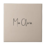 Trend Colour - Soft Taupe Name Ceramic Tile<br><div class="desc">Introducing the classic and elegant spring shade: Soft Taupe. Elevate your home decor with our modern and stylish ceramic tile, featuring a customisable name in a charming handwritten font, looking like a signature. Its elegant and minimalist design in solid colour exudes timeless appeal, making it perfect for personal use or...</div>