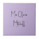 Trend Colour Soft Violet Name Ceramic Tile<br><div class="desc">Introducing the vibrant spring shade: Soft Violet. Elevate your home decor with our modern and stylish ceramic tile, featuring a customisable name in a charming handwritten font in classic black, looking like a signature. Its elegant and minimalist design in solid colours exudes timeless appeal, making it perfect for personal use...</div>