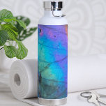 Trendy Modern Marble Stone Colourful Water Bottle<br><div class="desc">Stunning and colourful rainbow hued labradorite stone photo makes the perfect backdrop for a simple and modern design. This is a closeup of a real natural labradorite stone with blue,  purple,  pink,  yellow,  and green.  Chic Modern Stylish Crystal Stone Colourful Water Bottle</div>