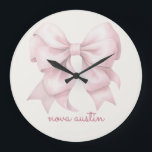 Trendy Pink Bow Personalised With Name Monogram Large Clock<br><div class="desc">Add a touch of timeless elegance to your decor with the Trendy Pink Bow Personalised With Name Monogram Large Clock. Featuring a chic preppy coquette bow in a soft pink watercolor design, this clock combines vintage girly charm with modern sophistication. The personalised name monogram makes it a unique and thoughtful...</div>