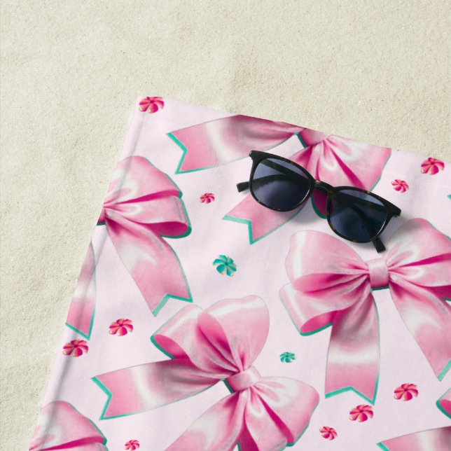 Trendy pink coquette bow pattern with cute girly beach towel (In Situ)
