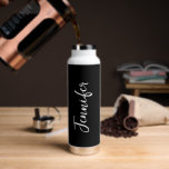 Trendy Stylish Script Name Black And White Womens Water Bottle<br><div class="desc">Stay hydrated during you gym workout with this Trendy Stylish Script Name Black And White Women's Water Bottle. It is trendy modern designed with a black background around the bottle. Name is in white hand script lettering vertical on centre front. Perfect gift idea for her! CLICK PERSONALIZE TEMPLATE OPTION AND...</div>