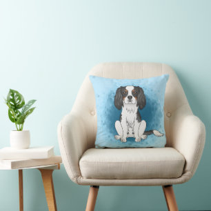 Tricolor Cavalier King Charles Spaniel Dog On Blue Cushion