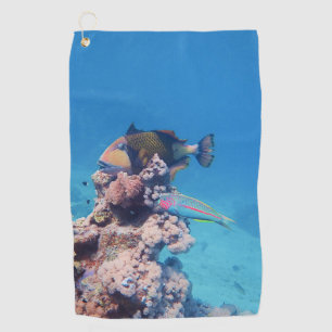 Triggerfish rests on a coral block at coral reef golf towel