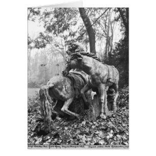 Tritons grooming two horses of the sun in