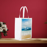 Tropical beach and blue sky with text reusable grocery bag<br><div class="desc">Your beach bag for the summer! An almost abstract image of a tropical beach,  the ocean and the sky. With the text: sun sea salt.  Large,  bold white letters.
With the colours beige,  white,  mint green,  turquoise and shades of blue.</div>