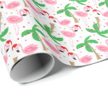 Tropical Beach Christmas Flamingos Birds Wrapping Paper<br><div class="desc">Beach theme Christmas gift wrap with flamingos wearing Santa hats. Ornaments and holiday lights decorate the palm trees. Wrap your gifts in warm winter cheer. You can make the pattern larger or smaller. Click on Customise It and use the plus/minus buttons to adjust the size. Copyright Bendel Creative Design LLC...</div>