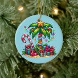 Tropical Christmas Palm Tree Ceramic Tree Decoration<br><div class="desc">An ornament with a seasonal holiday image. A tropical palm tree decorated in festive lights with a star on top. A giant red and white candy cane sticking out of the sand. Christmas presents under the tree. Whimsical and fun.</div>
