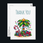 Tropical Christmas Palm Tree Thank You            Postcard<br><div class="desc">Thank you postcard with a seasonal holiday image. A tropical palm tree decorated in festive lights with a star on top. A giant red and white candy cane sticking out of the sand. Christmas presents under the tree. Whimsical and fun.</div>