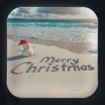 Tropical Christmas Snowman On a Beach Paper Plate<br><div class="desc">A small sand snowman wearing a Santa hat stands on an ocean beach with "Merry Christmas" written in the sand</div>