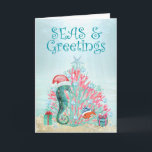 Tropical Coral Christmas Tree Seas and Greetings Holiday Card<br><div class="desc">Tropical, nautical themed holiday card features a "Christmas under the sea" whimsical scene with a cute seahorse wearing a Santa hat and a goldfish gathered around a coral Christmas tree topped by a starfish wishing you "Seas and Greetings". The greeting on the inside can be personalised (shown with "Warmest wishes...</div>