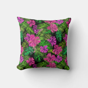 Tropical flowers and plants on black cushion
