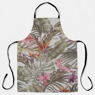 Tropical flowers, palm leaves, bird of paradise apron