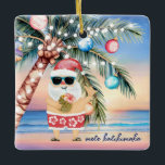 Tropical Island Palm Tree & Santa Christmas Ceramic Ornament<br><div class="desc">Santa’s left the North Pole behind and is on a tropical vacation, getting his luau on! 🎅🌴 This fun ceramic Christmas ornament features a watercolor beach sunset scene with Santa sporting Hawaiian shorts, sipping a pineapple cocktail beside a palm tree decked out in lights. The front reads “Mele Kalikimaka” (customisable),...</div>