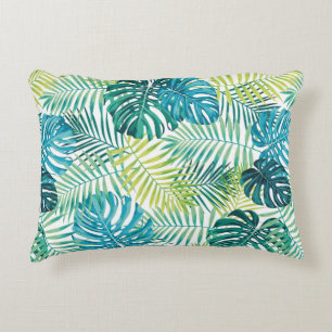 Tropical leaf design featuring green/blue palm and decorative cushion