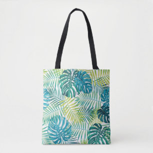 Tropical leaf design featuring green/blue palm and tote bag