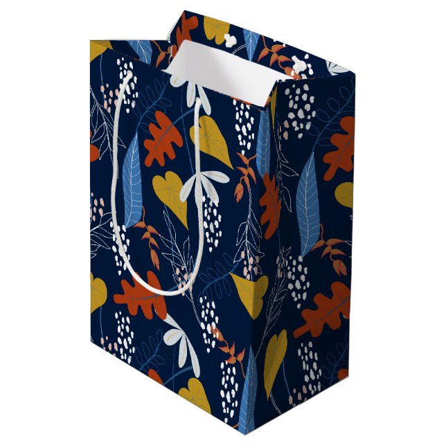 Tropical leaves and flowers pattern medium gift bag (Back Angled)