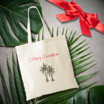 Tropical Merry Christmas Palm Trees Beach  Tote Bag<br><div class="desc">Tropical Beach Merry Christmas tote bag,  with a palm trees illustration and script typography. With customisable lettering,  you add your own information. A cheerful accessory for your holiday shopping.</div>