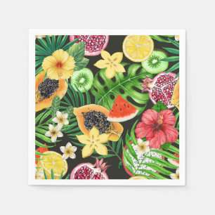 Tropical mix-fruit, flowers and leaves on black napkin
