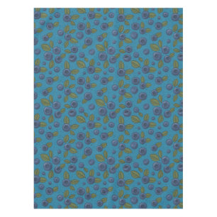 Tropical mix-fruit, flowers and leaves on black tablecloth