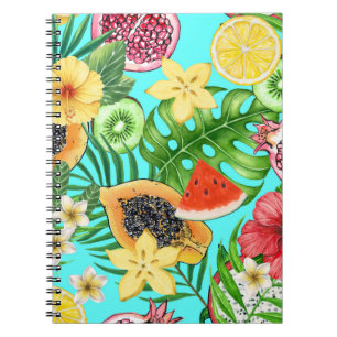 Tropical mix-fruit, flowers and leaves on blue notebook