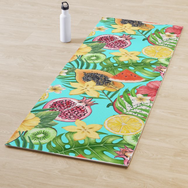 Tropical mix-fruit, flowers and leaves on blue yoga mat (In Situ)