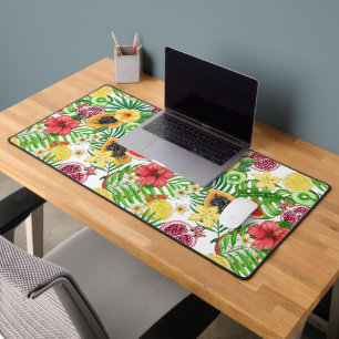 Tropical mix-fruit, flowers and leaves on white desk mat