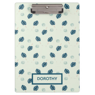 Tropical monstera leaves monogram on blue clipboard