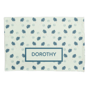 Tropical monstera leaves monogram on blue pillowcase