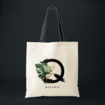 Tropical Monstera Letter Q Monogram Bridesmaid Tote Bag<br><div class="desc">Customisable letter Q monogram tote bag featuring watercolor tropical monstera leaf,  faux gold foil leaf and black watercolor brush accents. Personalise this tropical monogram tote bag by adding your name or other details. This boho letter Q monogram bag will be perfect as a gift. Other letters are available.</div>