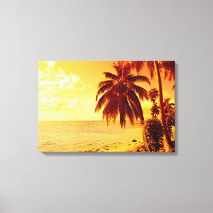 Tropical palm trees at a beach at sunset canvas print