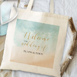 Tropical Sandy Ocean Beach Wedding Welcome Tote Bag<br><div class="desc">Wedding welcome bags with elegant gold calligraphy and watercolor beach scene. Design features a tropical sandy beach with gorgeous clear ocean waves lapping the shoreline. The template is ready for you to add the name of the bride and groom. For coordinating items,  please see my Boho Beach wedding collection.</div>