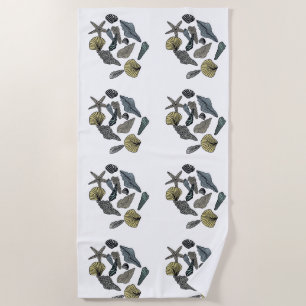 Tropical seashells on a beach towel