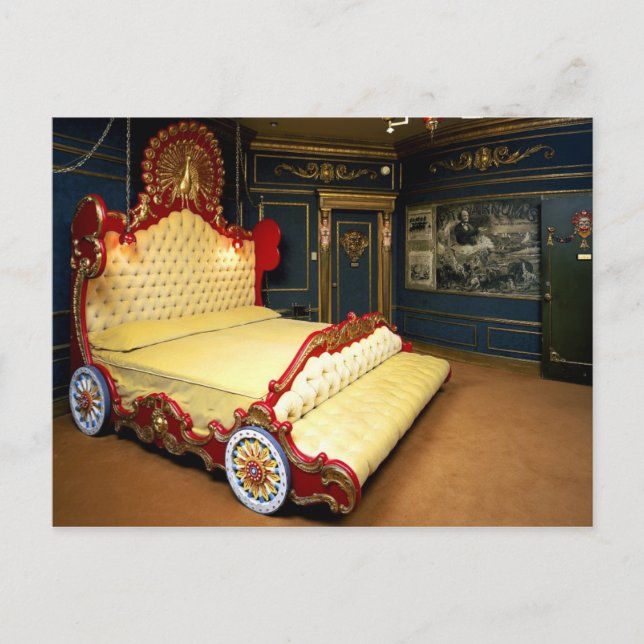 Tufted sleigh bed with wheels and a peacock postcard (Front)