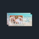 Turquoise Ocean Beach Christmas Photo Card<br><div class="desc">Tropical beach ocean family Christmas photo card.  White starfish and aquamarine water decorate long cards with a single photo template.  “Merry Christmas and Happy New Year” is the sample greeting with a place for a signature.</div>