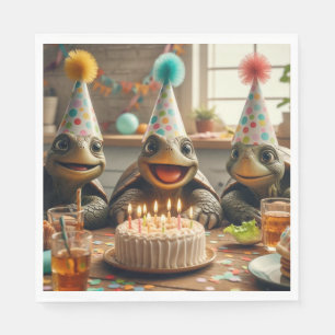Turtles celebrating birthday with cake and hats napkin