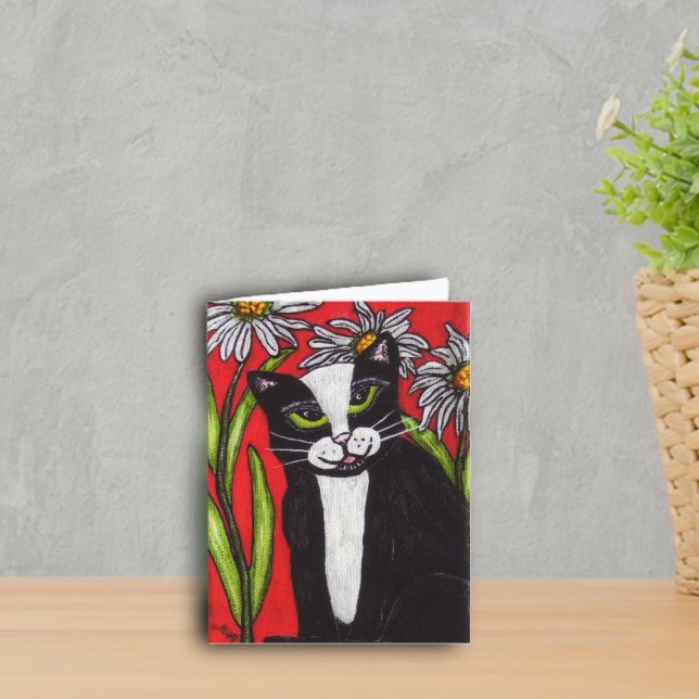 Tuxedo Cat in the Daisies Notecard (Tuxedo cat green eyes with daisy flowers on red notecard.)