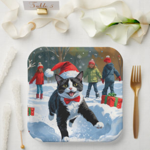 Tuxedo Cat Running in Snow with Christmas Hat Paper Plate