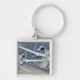 Two A-10C Thunderbolt II aircraft fly in format Key Ring