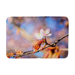 Two Amazing Sakura Flowers. Pink, Blue Background Bath Mat
