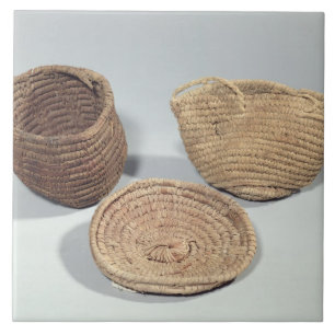 Two baskets and a cover (woven palm fronds) tile