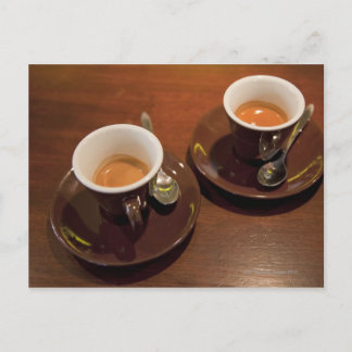 two cups of freshly brewed espresso coffee on a postcard