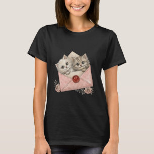 two cute kittens peeking out of a pink envelope T-Shirt