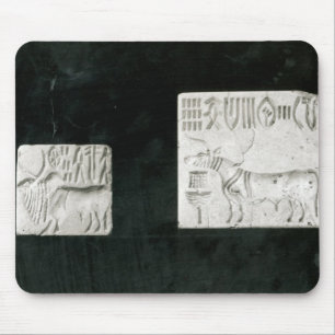 Two decorated seals depicting a zebu and a mouse pad