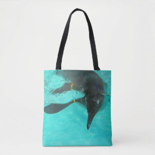 Two different penguins on blue tote bag