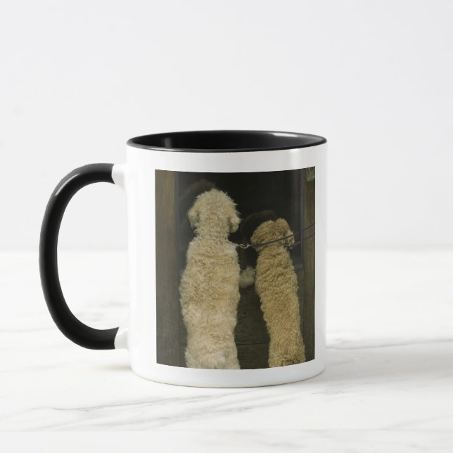 Two dogs looking in door window, rear view mug (Left)